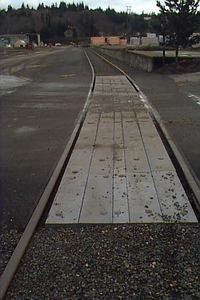 Railroad crossing panels made from MAXiTUF plastic lumber